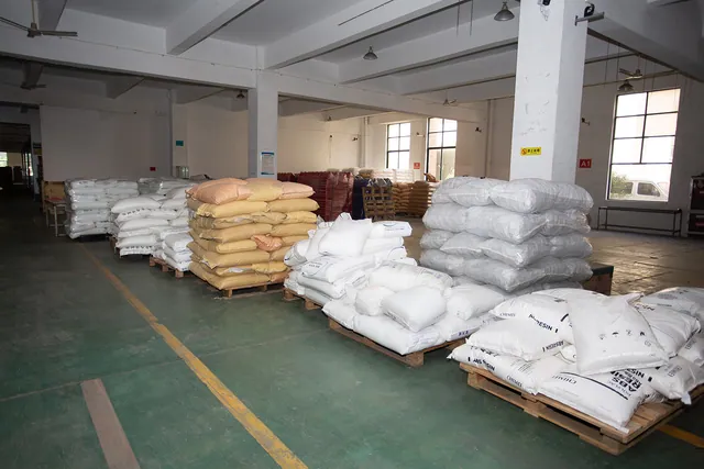 White packaging bags on pallets in the raw material store