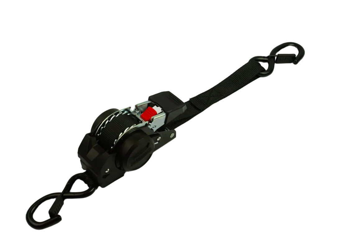 Self-retracting ratchet strap in black, showing the moulded housing and retracted webbing