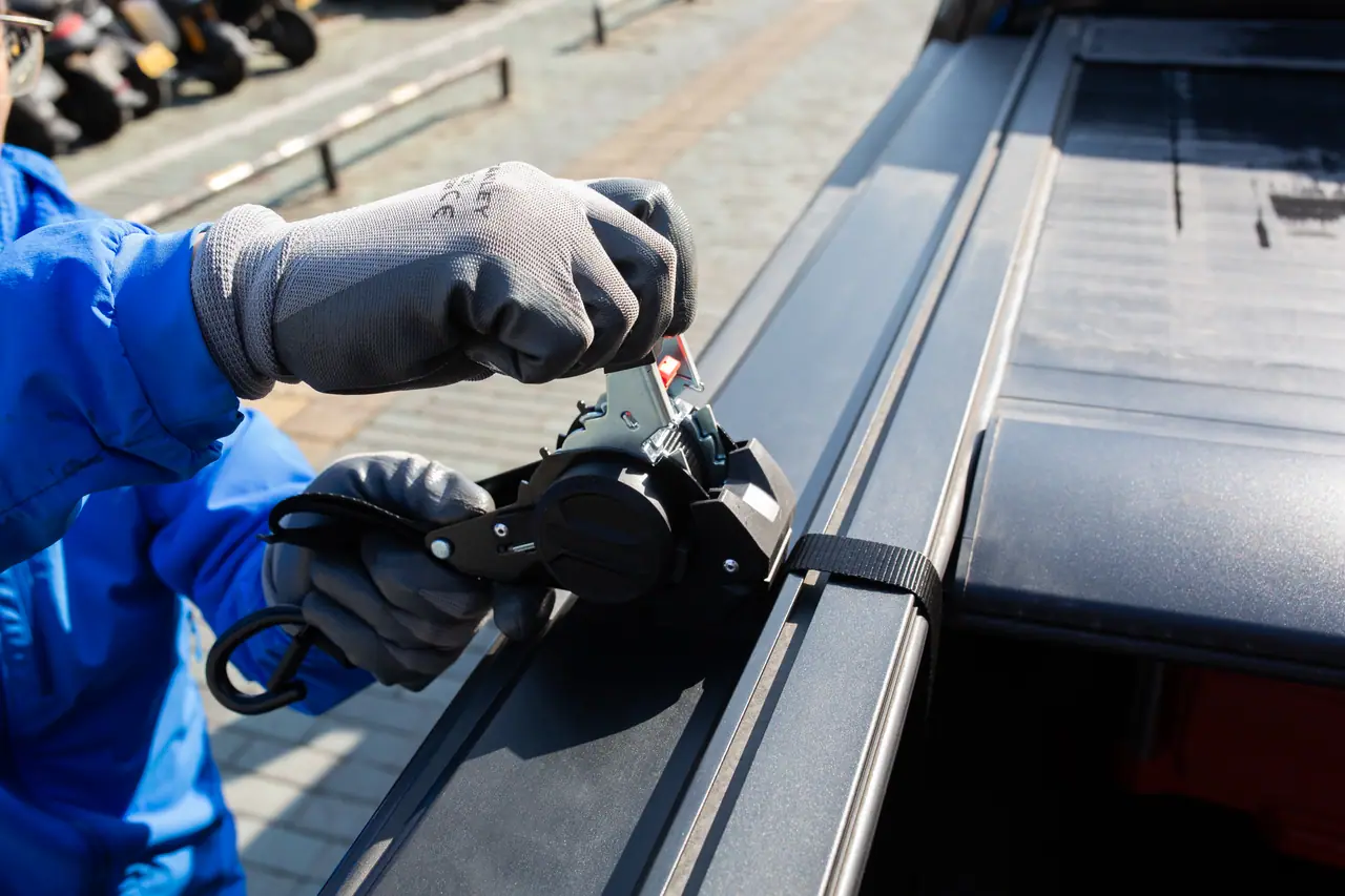 Ratchet strap hooked to a boat deck rail
